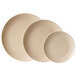 A close-up of three beige GET BambooMel round plates.