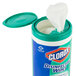 A container of Clorox disinfecting wipes with a white tissue inside.