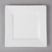 A white square porcelain plate with a thin edge.