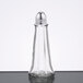 A clear glass salt shaker with a silver Eiffel Tower top.