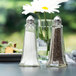 Two Eiffel Tower salt and pepper shakers on a table.
