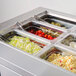 A Turbo Air refrigerated buffet table with food containers inside.