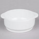 A white Arcoroc porcelain soup bowl with a handle.