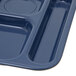 A dark blue Carlisle melamine tray with six compartments.