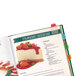 A cookbook with a recipe for strawberry cheesecake using Avery Ultra Tabs in assorted primary colors.