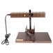 A brown metal Bron Coucke Raclette Machine stand with a black cord.