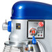 A blue and silver Vollrath 40 quart floor mixer with a white and blue guard.