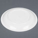 A white Cambro polycarbonate narrow rim plate on a gray surface.