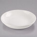 A Libbey ivory porcelain shallow pasta bowl on a gray surface.
