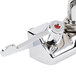 A white Equip by T&S wall mount faucet with wrist action handles.