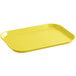 A yellow rectangular Cambro market tray with a handle.