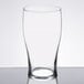 A Libbey customizable pub glass on a table.
