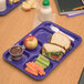 A Carlisle purple 6 compartment tray with a sandwich, fruit, and vegetables.