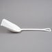 A white plastic Carlisle Sparta food service shovel with a handle on a gray background.