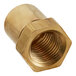 A close-up of a brass nut threaded on a white background.