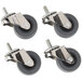 A set of four Manitowoc swivel casters with rubber wheels.