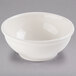 A white Libbey porcelain oatmeal bowl on a gray surface.