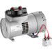 A silver Accutemp replacement motor and vacuum pump with red wires.
