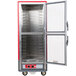 A red and silver Metro C5 heated holding cabinet with clear Dutch doors open.