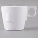A close up of a white Thunder Group Nustone melamine cup with a handle.