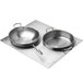 A Vollrath stainless steel double size adapter plate with two pans on a metal surface.
