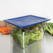 A Carlisle clear plastic food pan with lettuce and vegetables inside.