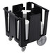 A black Cambro dish caddy with plates stacked in it.
