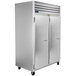 A white Traulsen G Series reach-in freezer with left/left hinged doors.