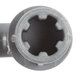 A black circular tool with a grey pipe connector.