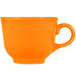 A white china cup with an orange handle.