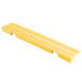 A yellow rectangular Cactus Mat edge ramp with a yellow striped end.
