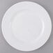 An Arcoroc Zenix white banquet plate with a white rim.