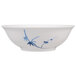 A white Thunder Group melamine bowl with blue bamboo designs.