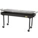 A black Crown Verity portable outdoor barbecue grill on wheels.
