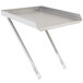 A stainless steel detachable drainboard tray on a metal table.