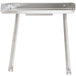 A silver metal detachable drainboard with legs.