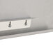 A stainless steel Advance Tabco detachable drainboard with metal hooks.