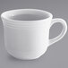 A white Tuxton round coffee cup with a handle.