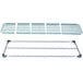 A MetroMax Q metal shelf with white plastic grates with a grid.
