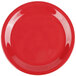 A close-up of a cranberry GET rolled edge plate with a white background.