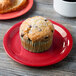 A cranberry Diamond Harvest melamine plate with a muffin and a cup of coffee on it.