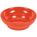 A red melamine bowl with a shiny surface.
