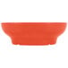 A red melamine salsa dish with a white interior.