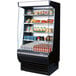 A Turbo Air black refrigerated display case with food items on it.