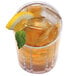 A glass of iced tea with a lemon slice and mint leaf sitting on ice.