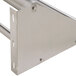 A stainless steel Advance Tabco wall mounted rack shelf with two tubular holes.