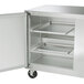 A Traulsen stainless steel undercounter freezer with two left hinged doors open.