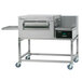 A stainless steel Lincoln Impinger conveyor oven with wheels.