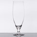 A clear Stolzle Imperial stemmed beer glass on a table.