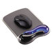 A black computer mouse on a blue and black Kensington Duo Gel Wave mouse pad.